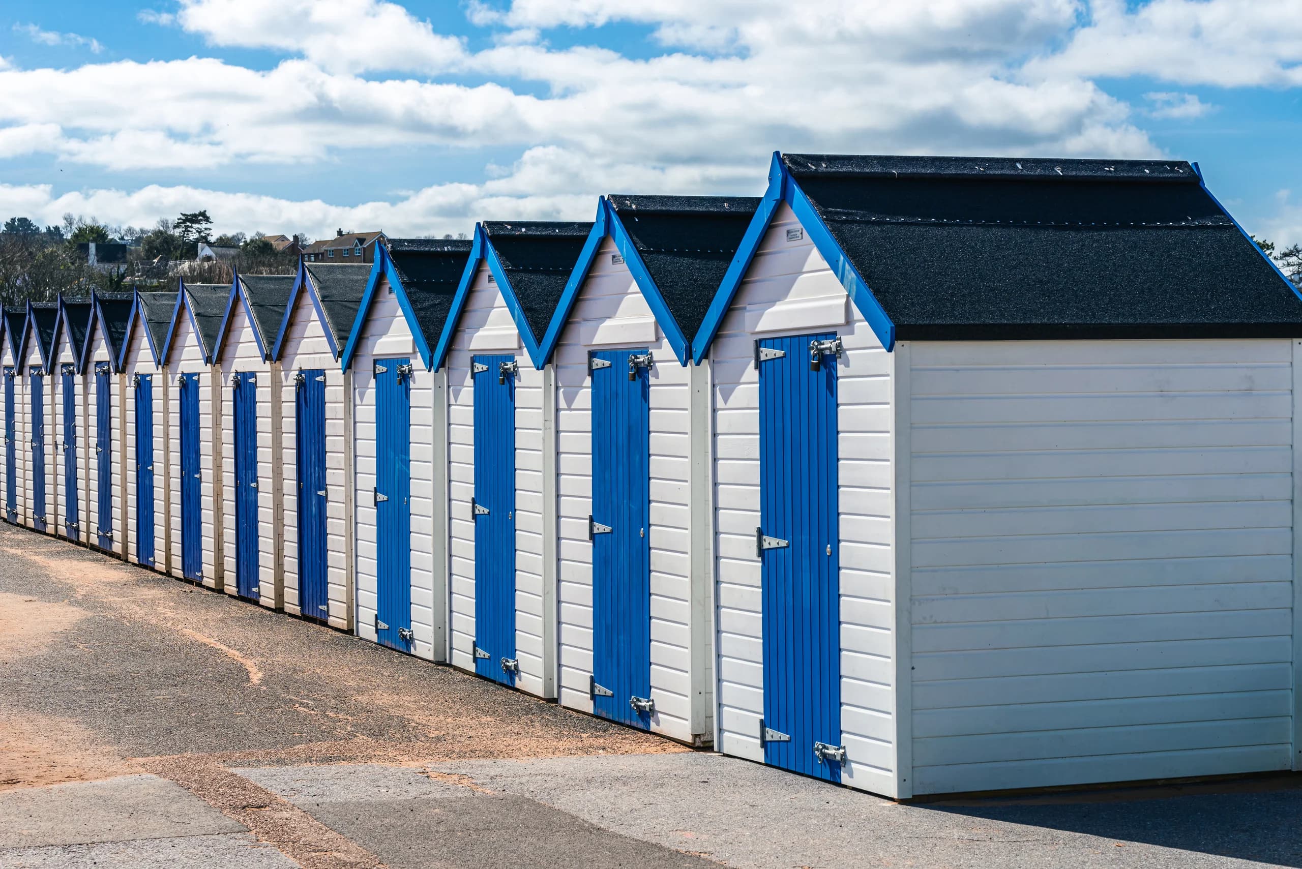 Blue and white beach huts at Goodrington